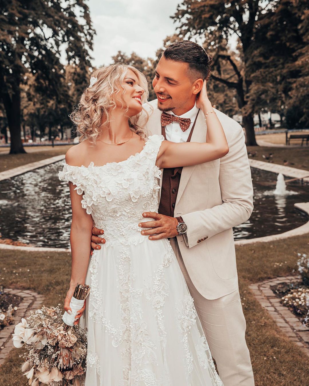 Elegant Off-the-shoulder 3D Floral A-line Wedding Dress with Lace Appliques
